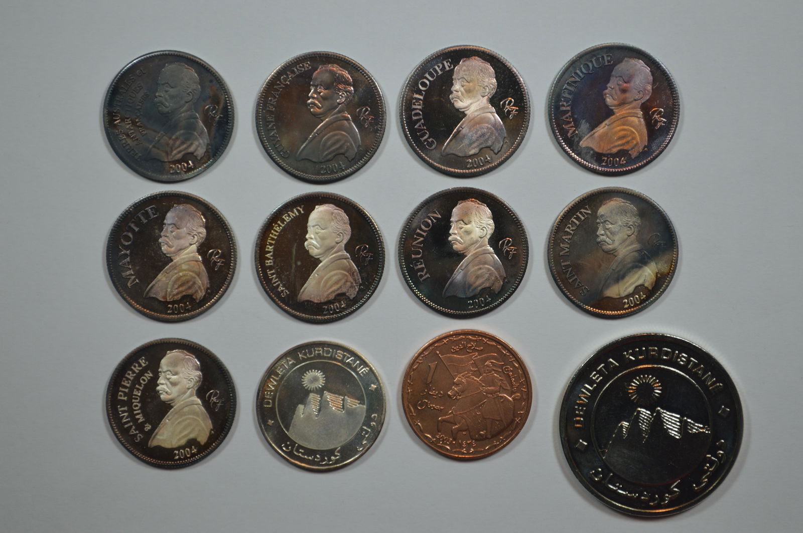 A Curious Nine-Piece Collection of Silver 1/4 Euro Essai Coinage (7.8 grams tw per coin). (1 of 2)