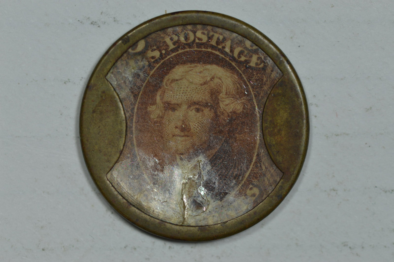 Encased Postage. 5c Kirkpatrick & Gault (EP-83, HB-162).: Encased Postage. 5c Kirkpatrick & Gault (EP-83, HB-162). VF in terms of wear however there is some staining on the case as well as some mica flaking at the lower obverse, none of which exposes the sta