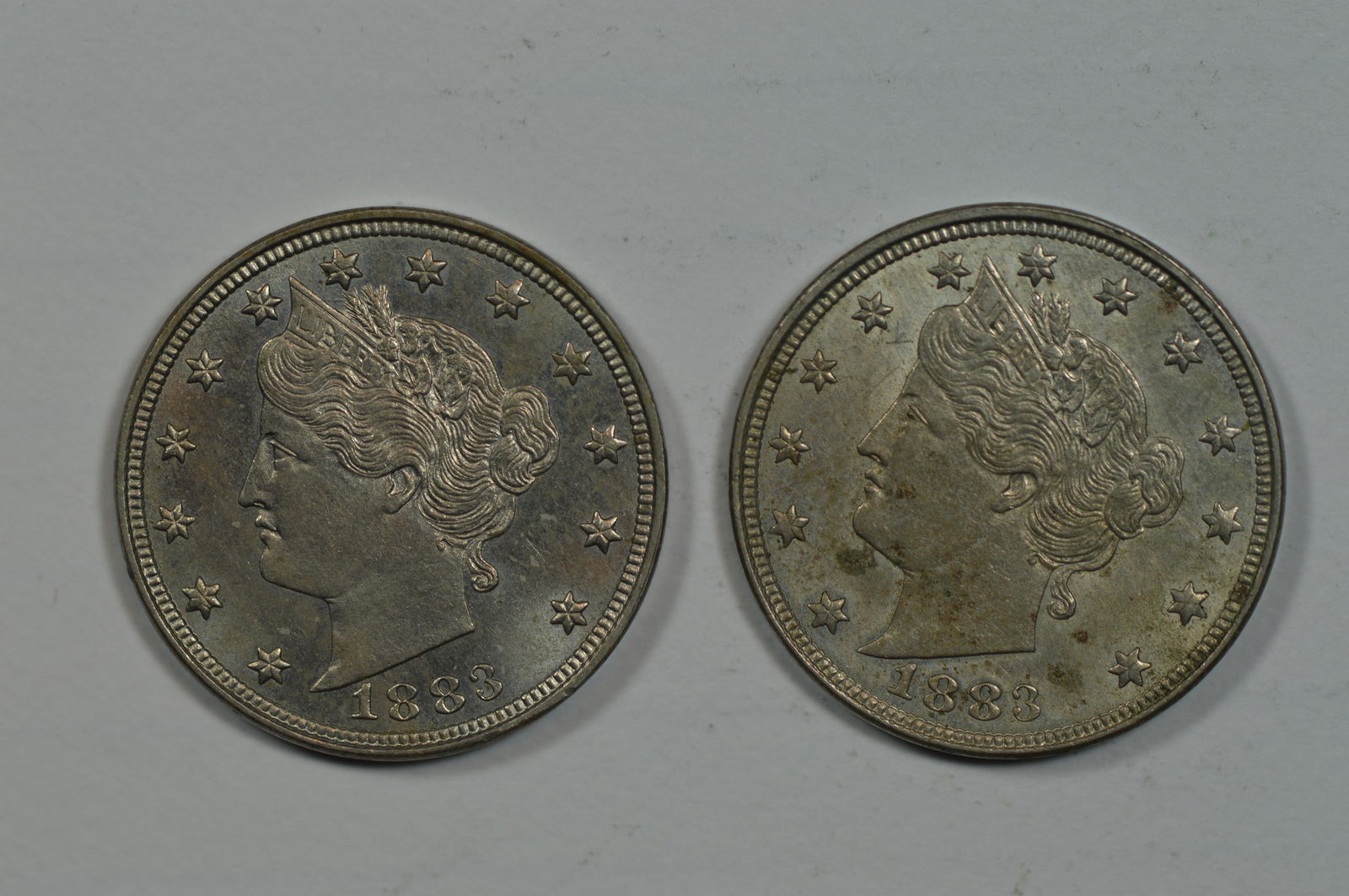 A 5c 1883 No CENTS Pair, both of which grade Ch AU+/BU-. (1 of 2)