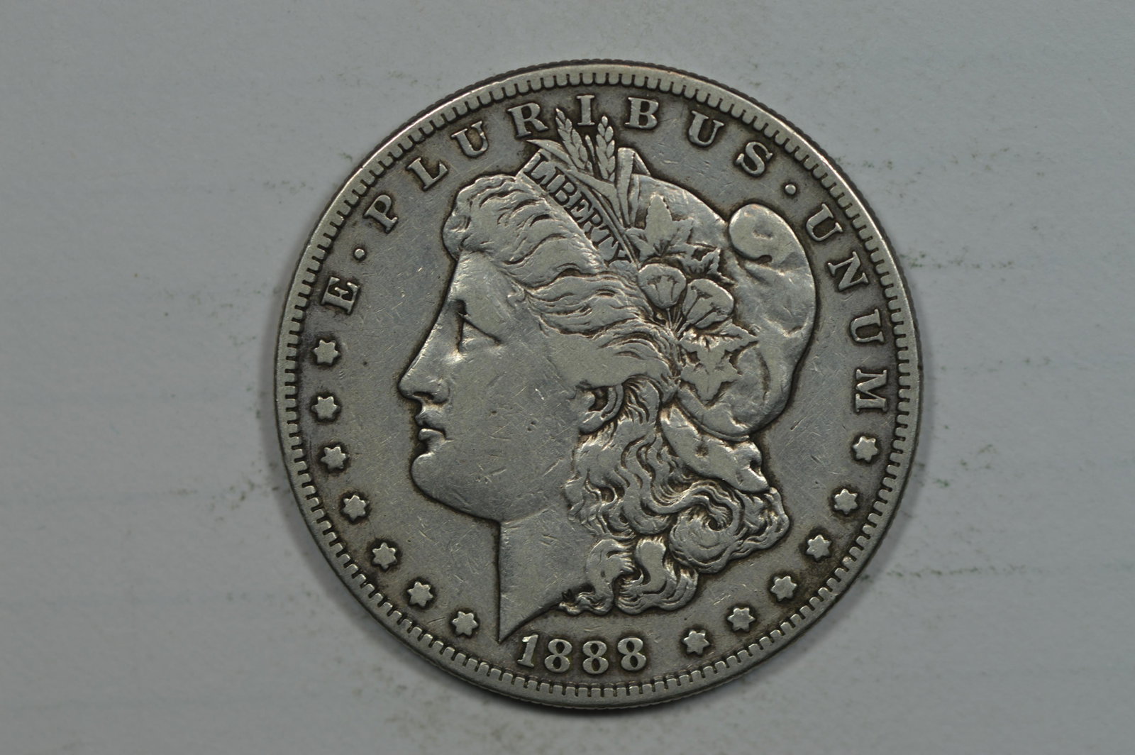 $1.00 Silver 1888-S Detail of VF: $1.00 Silver 1888-S Detail of VF however the surfaces reveal evidence of gentle cleaning. Est. $80.