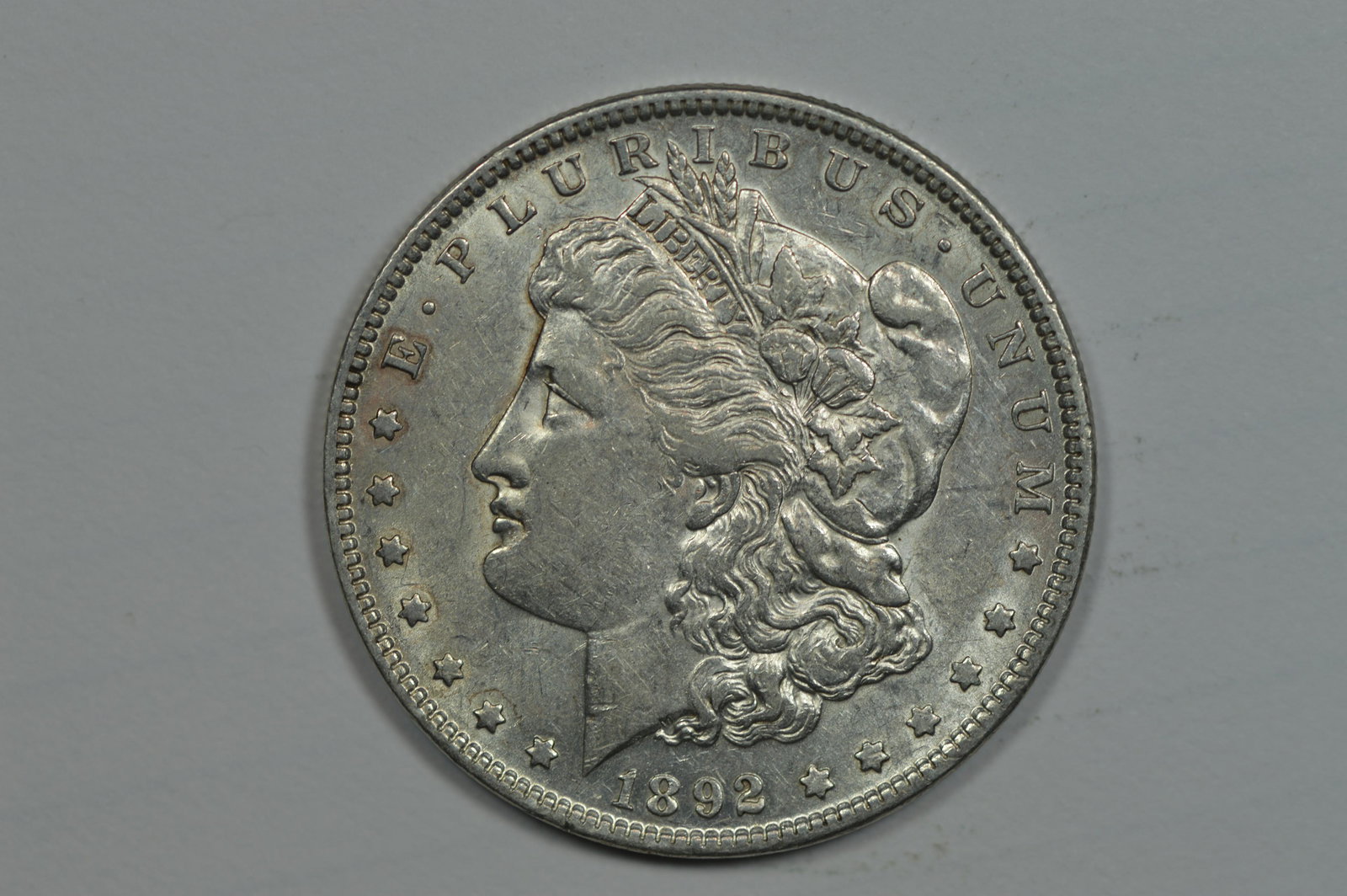 $1.00 Silver 1892 Abt. Unc. (1 of 2)