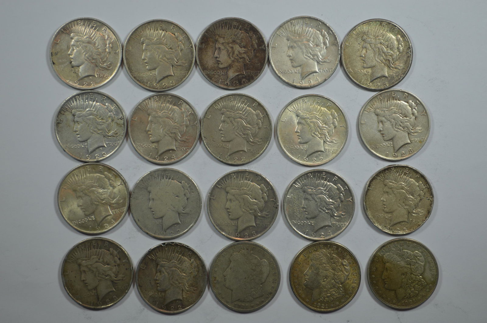 A Circulated Roll of Peace Dollars (17) and 1921 Morgan Dollars (3) (1 of 2)