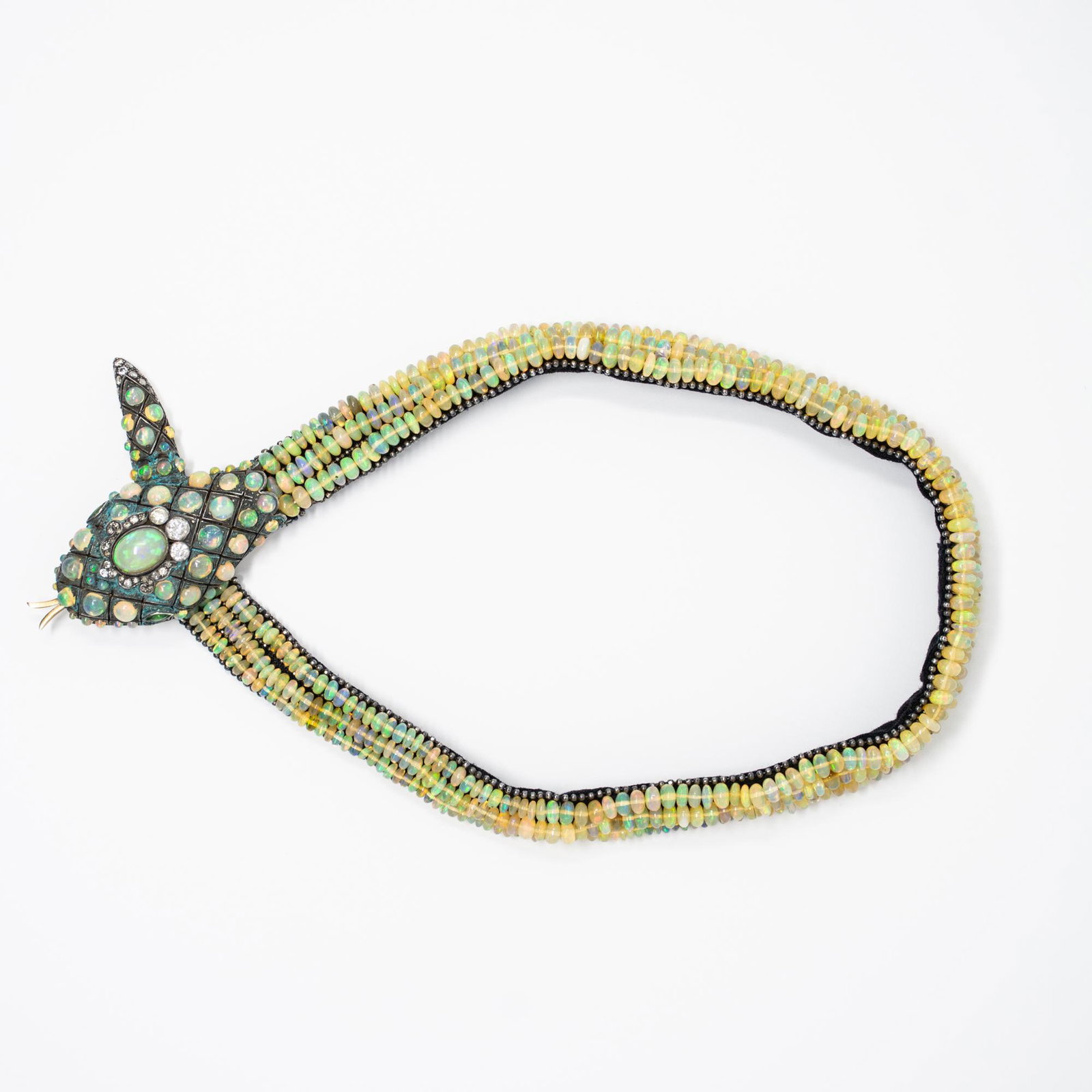 Exotic Estate Opal and Diamond Serpentine Necklace: This exotic snake necklace contains 485 opals and 40 diamonds. The diamonds weight approx 2.00cts. The necklace was handmade and measures 16" in length and is 0.5" wide. Two tsavorite garnets are used