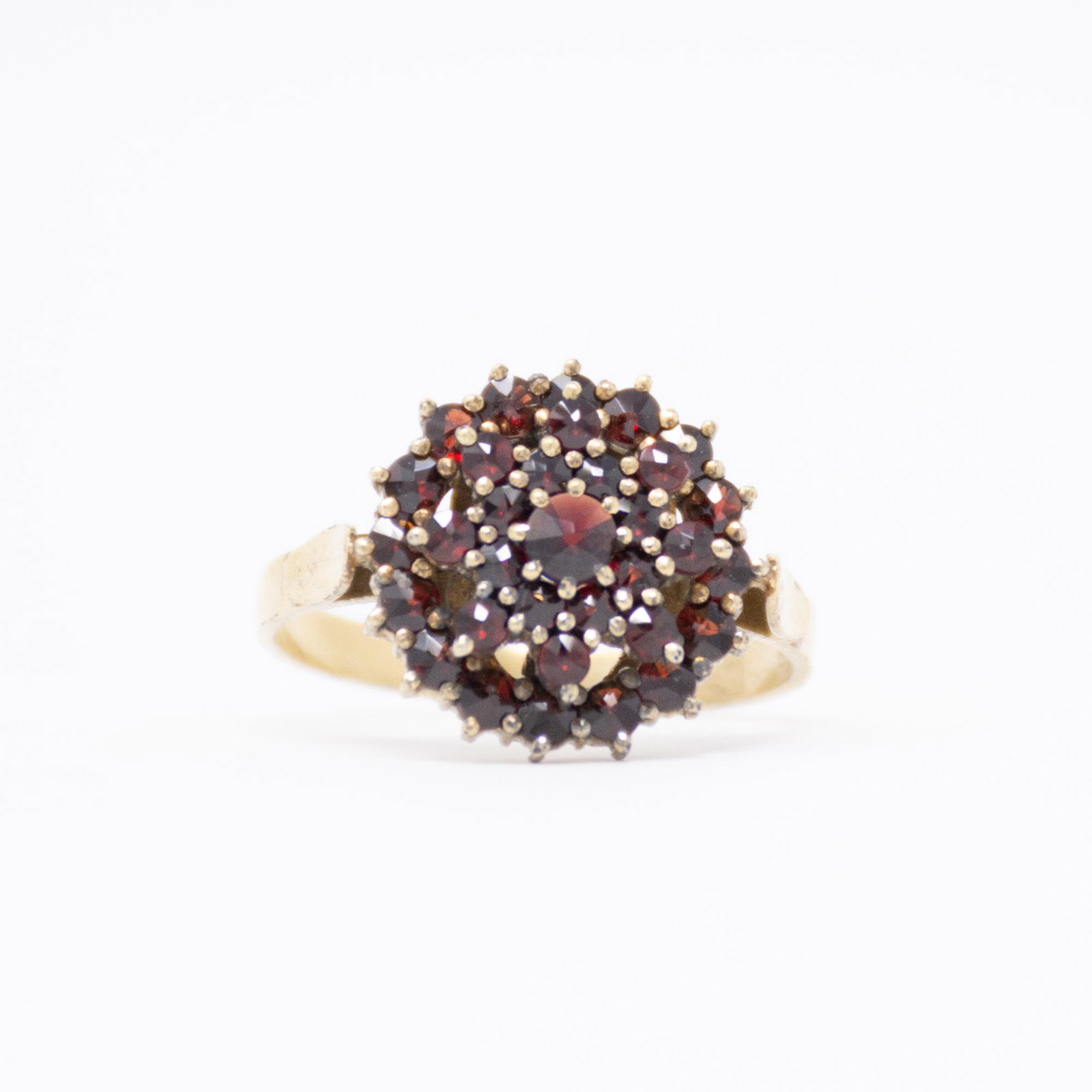 Vintage Bohemian Garnet Cluster Ring: Vintage. Vermiel over silver.Comfort fitted. 35 garnet total. Size 7.5 Total weight 3.3grams. Call Ridgleys for all other questions