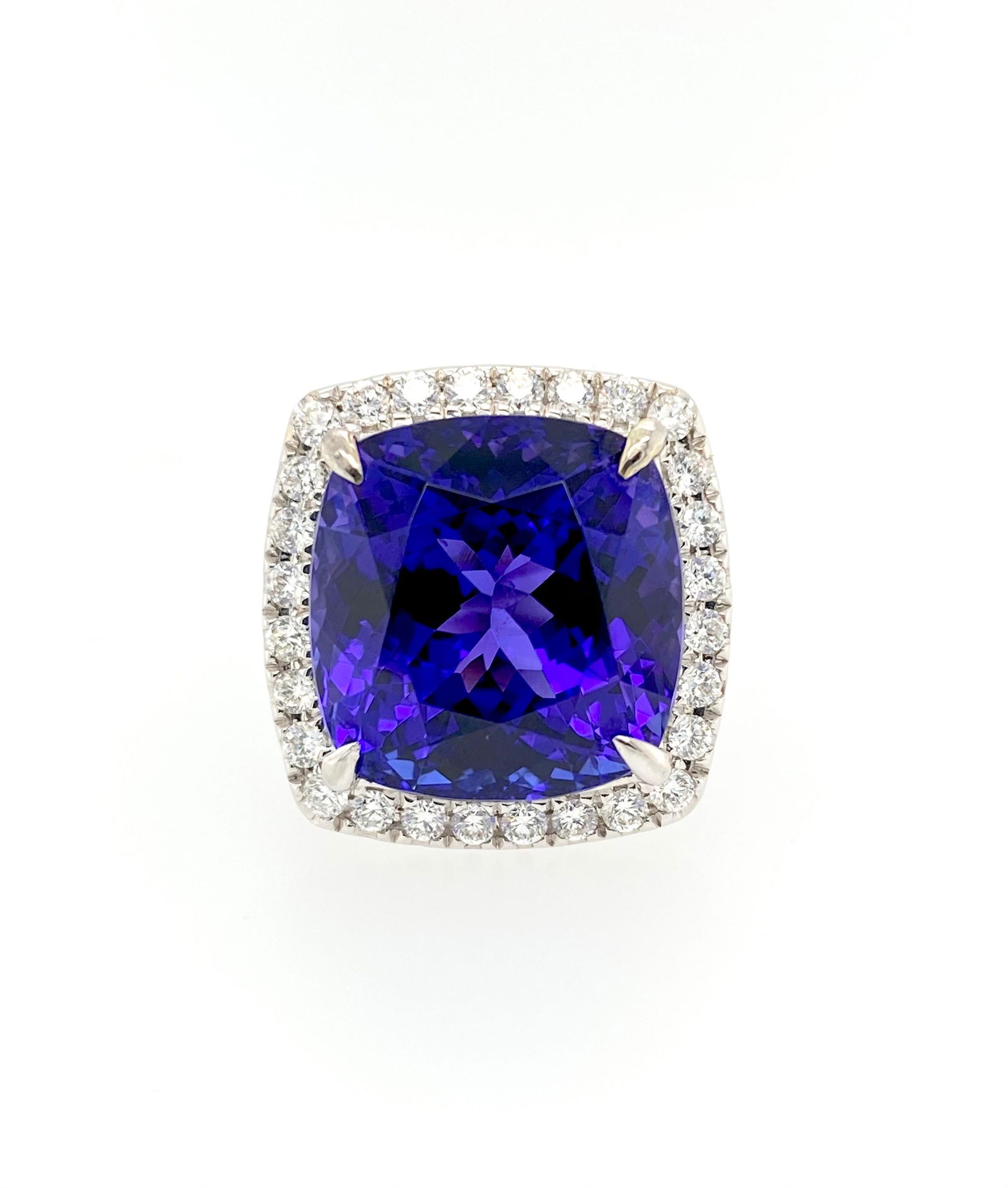 20.45ct Vivid Blue Tanzanite and Diamond Ring: Metal: 18k White Gold Weight: 12.52 Grams Stone: Vivid Tanzanite, Diamond Carat: 20.45ct (tanzanite), 1.26ct (diamond) Size: 7 Certification: AGL#1105845 This stunning ring is expertly hand crafted in