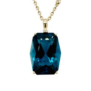 London Blue Topaz Pendant: Metal: 14KY Weight: 5.89 Grams Stone: London Blue Topaz, Diamond Carat: 21.90ctw Topaz, 0.10ctw Diamond Description: Estate fancy cut large london blue topaz, center stone measures 20x15mm.