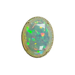 Large Cystal Opal Ring: Metal: 14KY Weight: 6.28 Grams Stone: Crystal Opal, Diamond Carat: 24.11ctw Opal, 0.33ctw Diamond Description: Estate Large opal with great color, Center stone measures 26x20mm. video upon