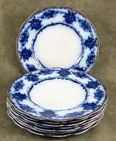 8 Wood & Sons flow blue "Milan" pattern 7.75" plate: 8 Wood & Sons flow blue "Milan" pattern 7.75" plates. Minor gold wear, 2 small flakes, no crazing.