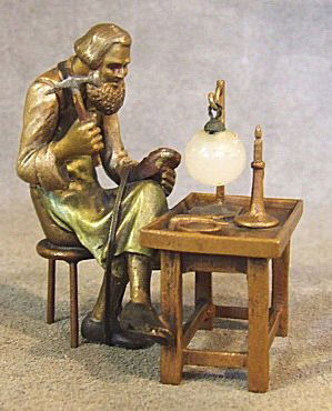 Vienna bronze figurine of cobbler at workbench, 2.: Vienna bronze figurine of cobbler at workbench, 2.25" high, 2" long. Marked under bench, unreadable.