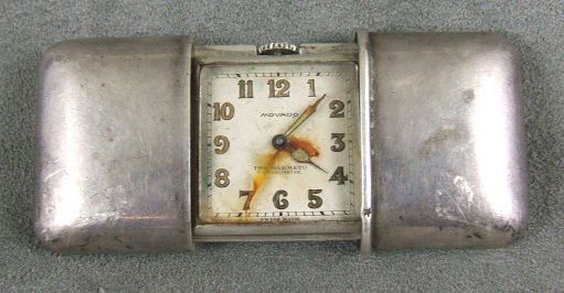 Movado sterling purse or pillow watch, runs, rust: Movado sterling purse or pillow watch, runs, rust on hands and dial face, 1.75" X 1.25"
