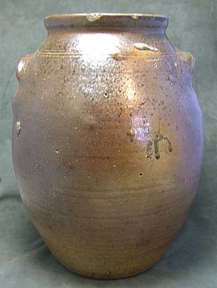 T.A. Vestal 5 gal. stoneware jar 15.5" H. 11" W. w: T.A. Vestal 5 gal. stoneware jar 15.5" H. 11" W. with brown glaze. Most likely Virginia potter. Several hairlines, bubble pops , chips on the edges. Impressed T.A. Vestal.