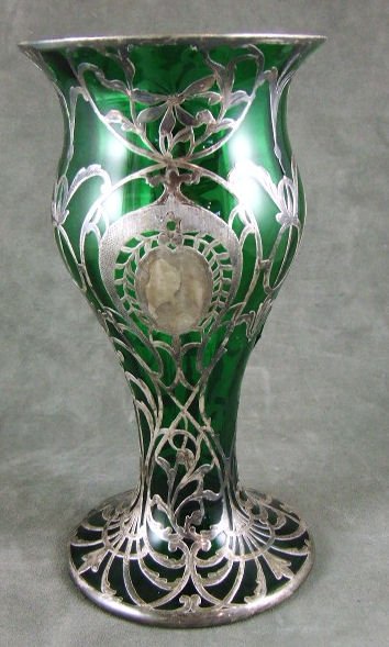Sterling silver overlay emerald green vase, 10" hi: Sterling silver overlay emerald green vase, 10" high. No damage to glass. Areas of silver missing.