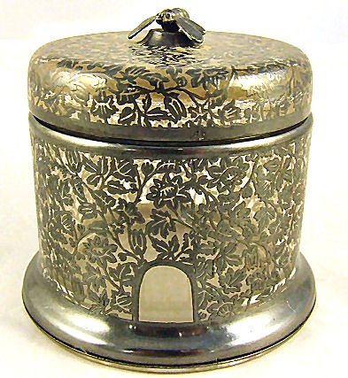 Silver overlay deposit jar measuring 3.75" in diam: Silver overlay deposit jar measuring 3.75" in diameter and 3.50" high. Figure of bee on lid, no overlay damage.