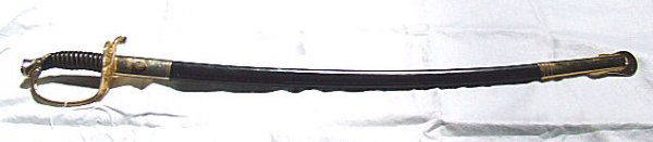 U.S. Marine NCO sword with blade engraved on both: U.S. Marine NCO sword with blade engraved on both sides, leather scabbard, fine condition, made in Toledo, Spain by Zubco, 32" blade, 38.25" overall.