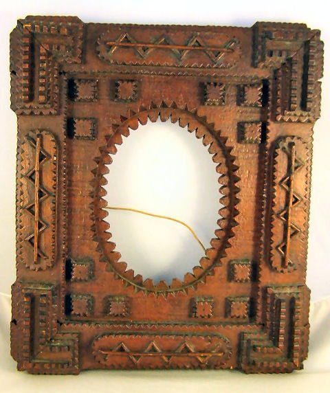 Nice folk art / tramp art chip carved frame with o: Nice folk art / tramp art chip carved frame with original finish, excellent condition with no missing pieces. 13.5" X 11.5"