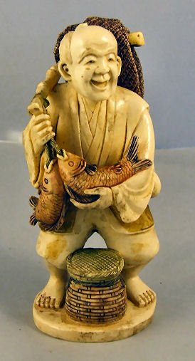 Asian carved ivory figurine, fisherman w/ basket, : Asian carved ivory figurine, fisherman w/ basket, fish & net, intricate detail. Artist signed on base, 6" tall