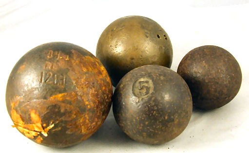 Lot of 4 cannon balls, largest 12 lbs., 4.5", 12 l: Lot of 4 cannon balls, largest 12 lbs., 4.5", 12 lb. brass cannon ball marked "Gill", 5 lb. cannon ball, and one unmarked.