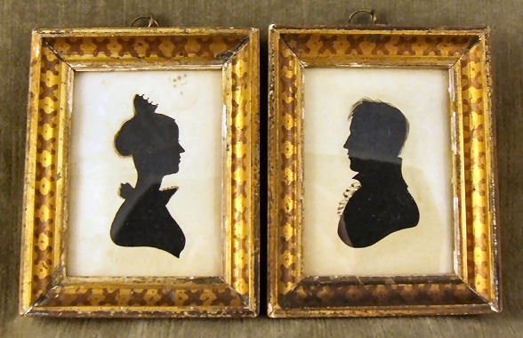 Pr. early 19th C. silhouettes, each signed William: Pr. early 19th C. silhouettes, each signed Williams, hollow cut with ink embellishments over fabric, period frames 4.5" X 5.5", water stains on paper of female subject.