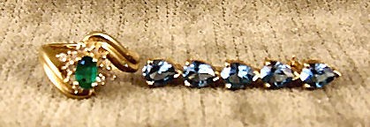 14K yellow gold ring set with diamonds and emerald c: 14K yellow gold ring set with diamonds and emerald colored stone, size 6, 14K yellow gold pin set with 5 heart shaped blue stones, 1.5" long - total weight of both is 8.2 grams