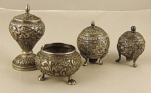 Pr. silver repousse shakers, pepper pot & salt cell: Pr. silver repousse shakers, pepper pot & salt cellar, unmarked and test as silver, .800 or better, very good condition with very minor dents, threaded plug on one shaker is replace with and iron plug