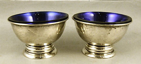 2 International Royal Danish sterling silver salt c: 2 International Royal Danish sterling silver salt cellars with cobalt glass liners, sterling and glass in excellent condition, no monograms. 2 5/8" wide, 1 3/4" high, 2.40 troy ounce silver weight