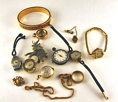 Misc. vintage jewelry lot including gold filled rin: Misc. vintage jewelry lot including gold filled ring, chain, watches, bracelet, etc. Elephant watch marked Germany, watch with pearls has enameled back, dial has crack.