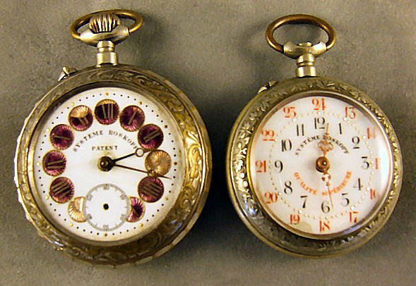 2 Systeme Roskoph pocket watches 2 1/4" & 2 1/8" di: 2 Systeme Roskoph pocket watches 2 1/4" & 2 1/8" dia. Not running, larger has damaged numerals, no crystal and missing second hand.
