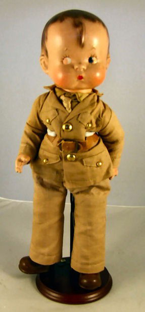 Effanbee Skippy, soldier uniform, no hat, 14.5" hi: Effanbee Skippy, soldier uniform, no hat, 14.5" high, paint peeling from eyes, surface crack on one hand and behind one ear, scratches on rear of head.