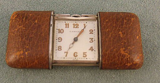 Cartier Movado purse / pocket watch, .935 silver c: Cartier Movado purse / pocket watch, .935 silver case # 1193545, leather covered outer case scuffed, 1 7/8" X 1 1/4" closed, has been running for several hours