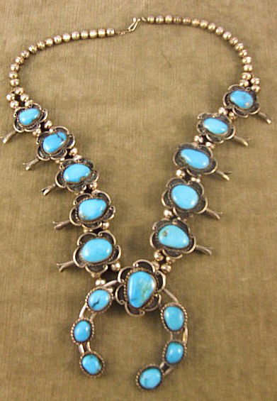 Native American squash blossom silver necklace set: Native American squash blossom silver necklace set with turquoise, 25" long, center piece 3" X 3.25", unmarked