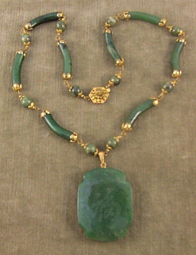 Miriam Haskell jade necklace with Chinese theme, m: Miriam Haskell jade necklace with Chinese theme, medallion with symbol on one side and scene on opposite side, base metal fittings, marked on clasp, 23" long, medallion 2 3/8" X 1.5"