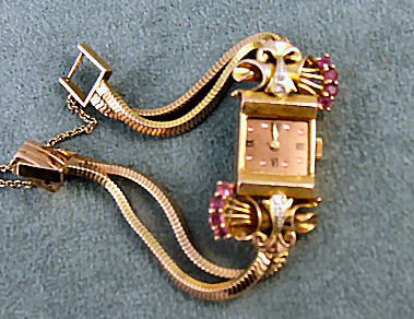 14K retro rose gold case diamond & ruby lady's wat: 14K retro rose gold case diamond & ruby lady's watch, 17 jewel Mohawk Swiss movement, running, gold plated band, case 1.5" long, .75"wide, no crystal