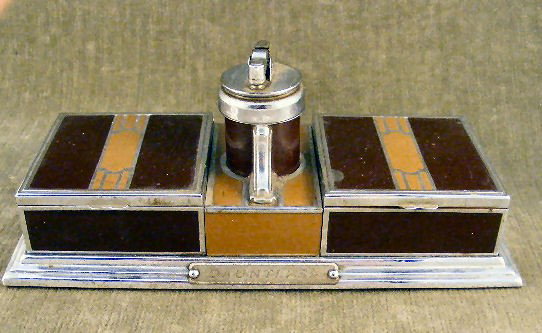 Ronson Art Deco design desk cigarette lighter & ca: Ronson Art Deco design desk cigarette lighter & case, "Dauntless" plaque on front, some spotting on finish, wood veneer interior,8.75" X 4"