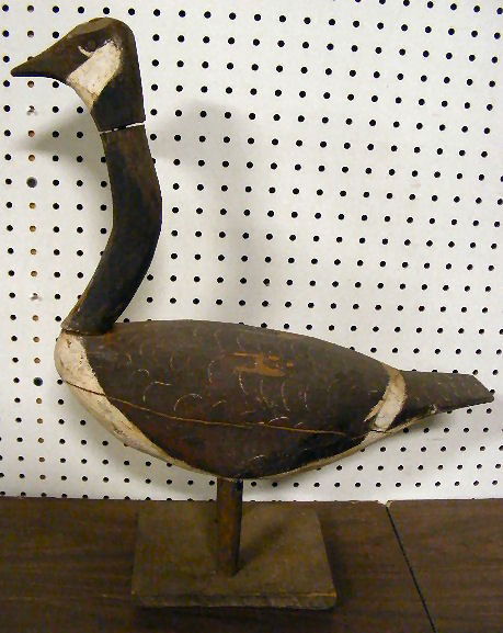 Canada goose decoy. Primitive with original paint,: Canada goose decoy. Primitive with original paint, some wear. 22" tall, 18" long, Some cracks & chips.