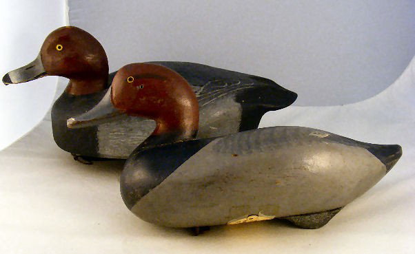 2 red duck decoys. Good paint & painted eyes. Tag : 2 red duck decoys. Good paint & painted eyes. Tag of bottom of one reads "Red Head Bob McGan Madison Mitchel Harve DeGrace MD 1951" The other duck has a name on bottom, see pictures.
