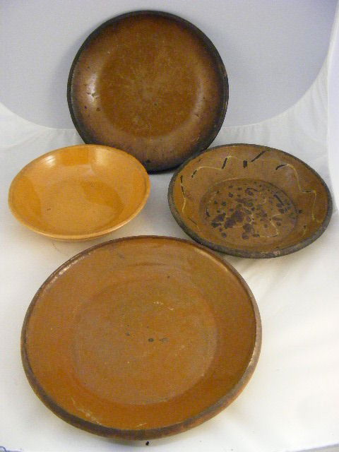 Redware & Yellwoware plates & bowls. 4 early piece: Redware & Yellwoware plates & bowls. 4 early pieces. Pie plate measures 11" diameter. Slipware piece has heavy flaking.