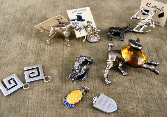 Lot of Trifari sterling poodle pin with topaz color: Lot of Trifari sterling poodle pin with topaz colored "stone" & nine misc. charms, approx. 1.7 troy oz. total weight