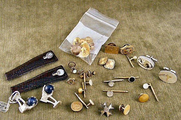 Lot of misc. jewelry including Laskow sterling pick: Lot of misc. jewelry including Laskow sterling picks in leather holders, sterling hand & ball cufflinks with lapis balls & misc. cufflinks, tie tacks & studs.