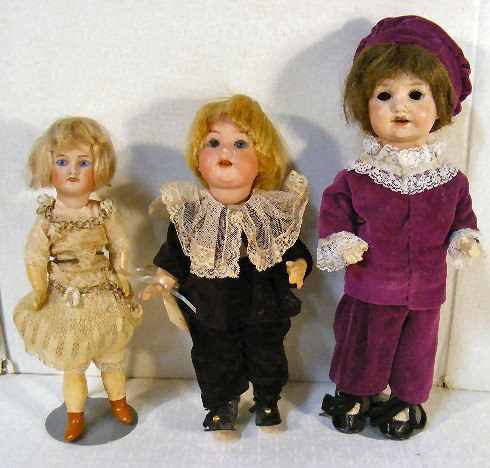 Lot of 3 small bisque head dolls, Unis France chil: Lot of 3 small bisque head dolls, Unis France child doll #60, 9" chip and repair on back of head under edge of pate, A.M. 990 character baby 10" and 12" A.M. 971 missing eyes