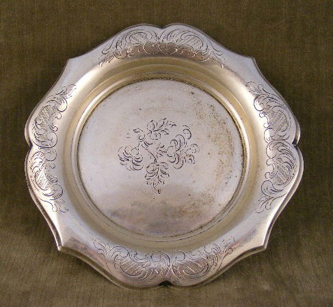 Continental silver wine bottle coaster, engraved d: Continental silver wine bottle coaster, engraved design, 6" diameter, pitch in base, total weight 4.25 troy ounces