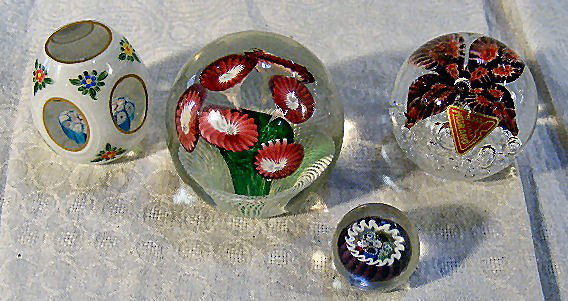 Collection of 4 paperweights, Murano glass w/ bubb: Collection of 4 paperweights, Murano glass w/ bubbles & flower. White, cut to clear w/ Millifiori center. Miniature w/ cane interior. Floral & basket. Light scratches on all. Largest is 3" high & 3" d