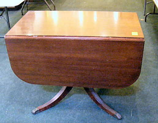 Mahogany drop leaf table, Duncan Phyfe legs. With: Mahogany drop leaf table, Duncan Phyfe legs. With leaves up 39" x 54". 29" tall.