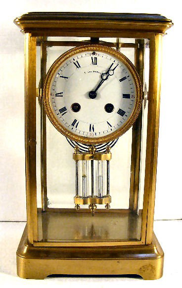 E. Caldwell & Co. clock, crystal regulator, beveled: E. Caldwell & Co. clock, crystal regulator, beveled glass with 2 corners damaged, 12" high, Japy Freres movement, Made in France, runs & stops. Porcelain dial excellent. No key.