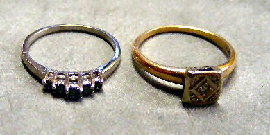 2 - 14K gold rings, 1 set with medium blue: 14K white gold ring set with medium blue colored stones, 1.7 grams, size 7 and 14K yellow gold ring set with very small diamond, 2.7 grams, size 8