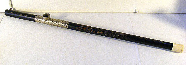 Antique Asian pipe, etched with flowers & writing,: Antique Asian pipe, etched with flowers & writing, Ivory / bone mouth piece, 21.5" long. Silver colored metal bowl.