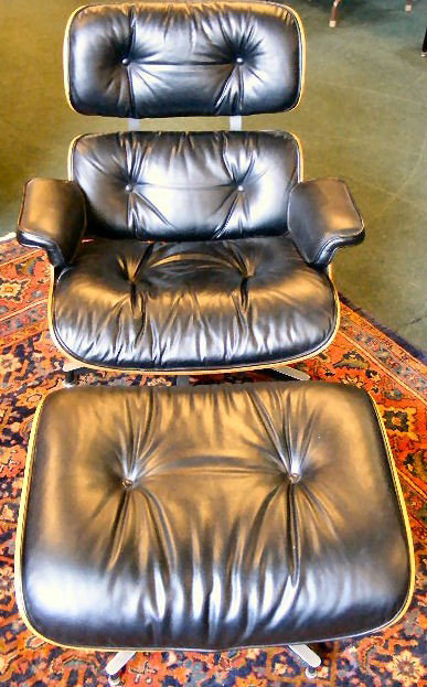 Herman Miller Eames chair & ottoman. 1977 model w: Herman Miller Eames chair & ottoman. 1977 model with stickers & label. 33" tall x 32" wide. Excellent condition.