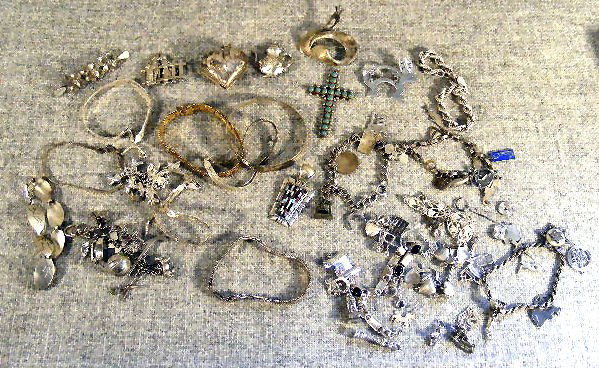 Collection of sterling and silver jewelry, Charms: Collection of sterling and silver jewelry, Charms & charm bracelets, pins, pendants & braclets. 10.23 ozt.