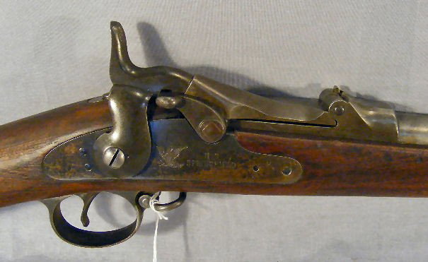 Model 1884 Springfield trapdoor rifle, 51" long, : Model 1884 Springfield trapdoor rifle, 51" long, inspector marks on stock, rear sight missing as well as barrel band, mechanically strong, end of barrel uneven, no finish on barrel. Serial #526629. So