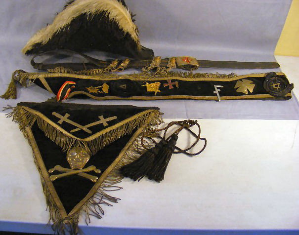 Early 20th. Century Ames Sword Co. Masonic hat, sas: Early 20th. Century Ames Sword Co. Masonic hat, sash, apron & belt, soiled, some fringe damage