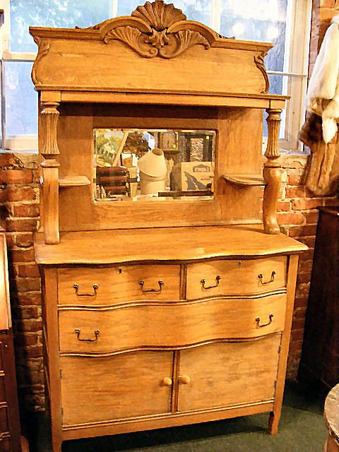 Antique oak buffet w/ mirrored back. Top comes of: Antique oak buffet w/ mirrored back. Top comes off, boards missing from back of chest and chips on edges of doors. 6'.8" x 3'.9" x 20" deep.